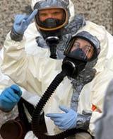 Biohazard team member signals to a co-worker