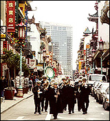 The Green Street Mortuary Band leads a funeral up Chinatown's Grant Avenue.