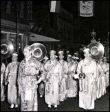 The Cathay Band performs in a Chinatown New Year's parade, circa 1940.